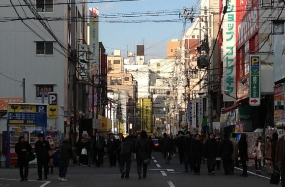 While walking in Osaka last night, I came across a large ad