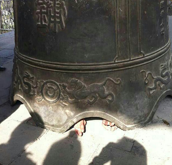 Ding, Dong, Boom: Giant Temple Bell Falls on Chinese Tourist, Traps Him Inside