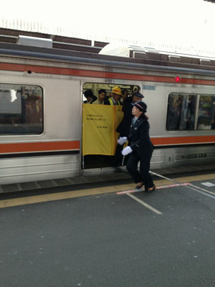 Commuters risk life to board local train through half-open doors
