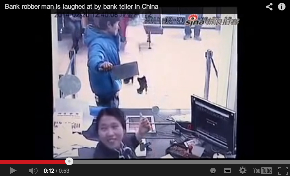 Chinese bank teller becomes internet sensation for belly laughing at knife-wielding robber【Video】