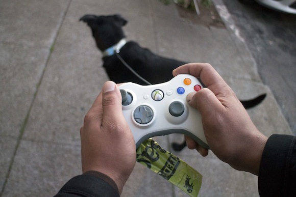 Creative pet owner turns Xbox 360 controller into dog leash (with poop bag dispenser!)