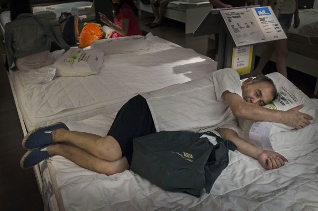 Bizarre photos of Chinese shoppers napping at Ikea