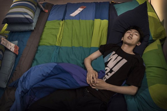 Bizarre photos of Chinese shoppers napping at Ikea7
