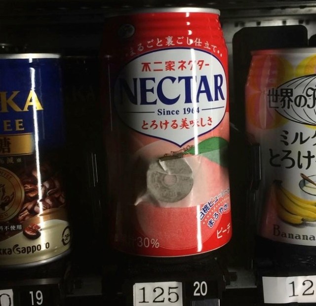 Creative problem solving: Vending machine dispenses cans with 5 yen coins taped to them