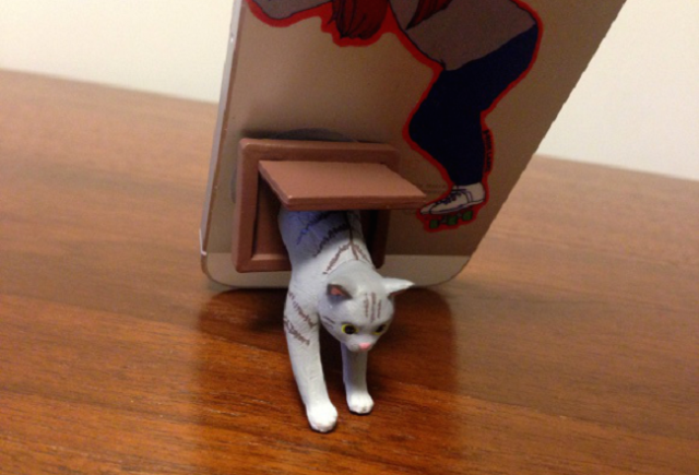 Cats are ready to burst out of your smartphone with these cool suction-cup stands