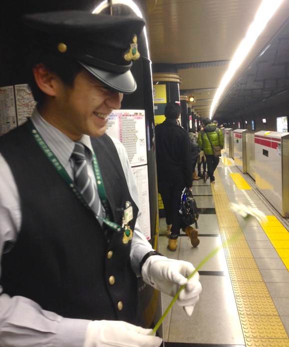 Daisuke Tokyo Metro subway worker, with gerbera flower, Alice, Lee Mingwei, The Moving Garden art installation