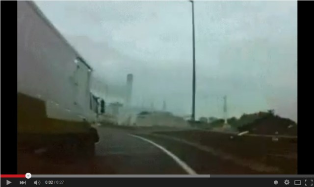 Truck driver hailed as “hero” for cutting off car on wet highway