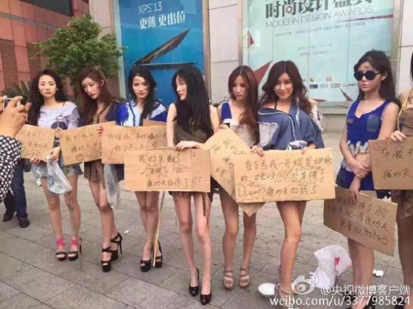 Unemployed Shanghai “booth babes” protest for their right to be sexy with cars