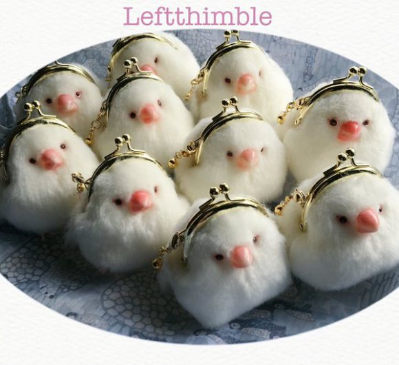 Check out these white balls of cuteness — irresistible java sparrow coin purses!!