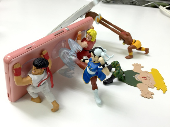 Beat your phone into submission with these Street Fighter 2 capsule toy stands