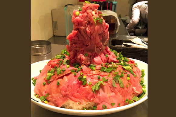 Rice bowl with a mountain of roast beef served in Tokyo bistro