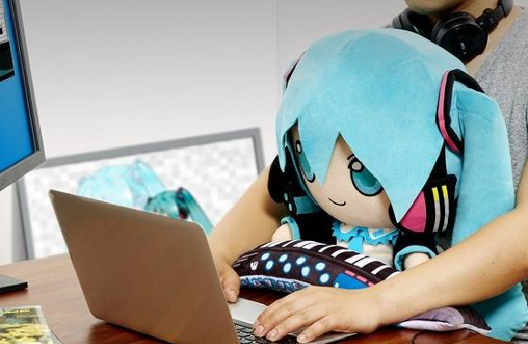 After pleasing your ears, Hatsune Miku is ready to ease your pain as a PC cushion plushie