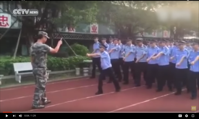 Uncoordinated Chinese police recruit hilariously struggles to march in step with fellow officers