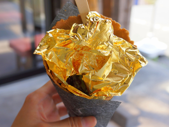 We eat gold-leaf “Kinkaku Soft Ice Cream” near Kinkakuji Golden Pavillion temple in Kyoto