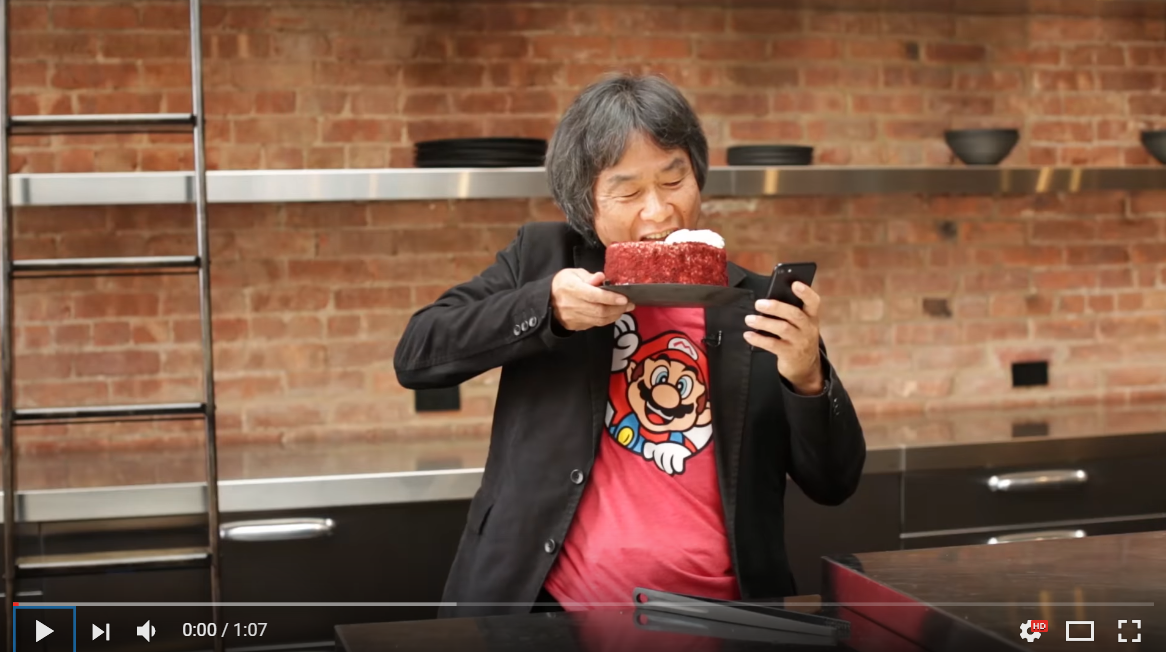 KoopaTV: Shigeru Miyamoto Eats a Hamburger To Prove His Point