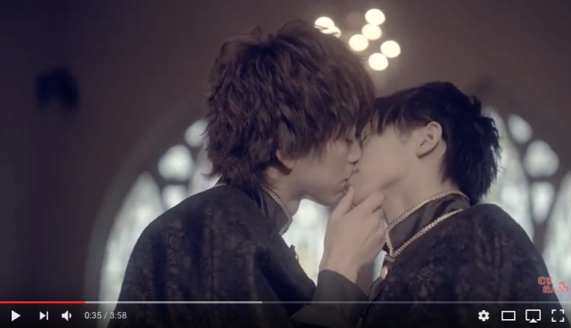 Japanese boy band shakes up the music world as all nine members kiss each other in new video clip