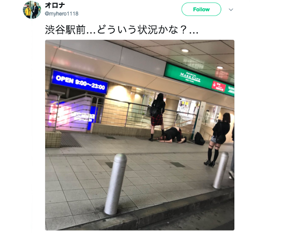 Japanese girls spotted stepping on foreigner outside Shibuya Station in Tokyo