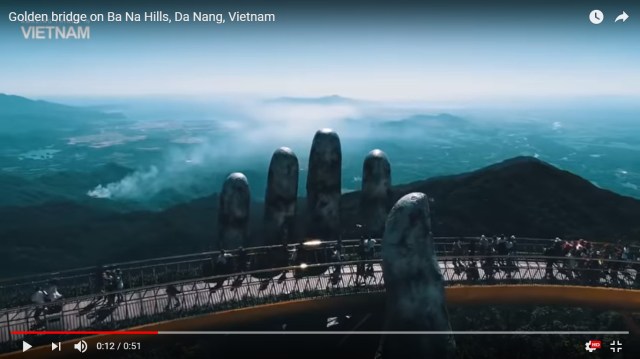 Whimsical new Vietnamese bridge looks like it’s held up by the hands of gods