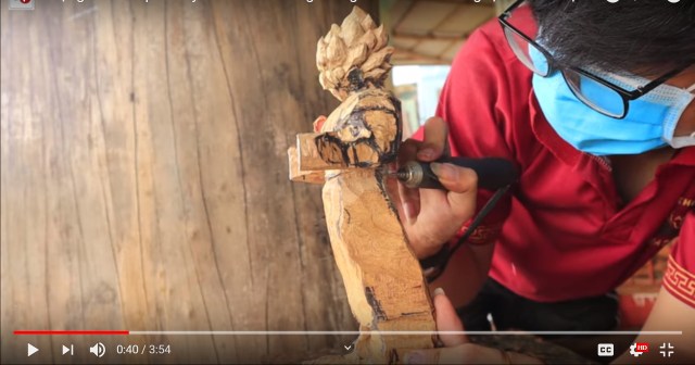 Awesome time lapse video shows Vietnamese artist carving amazingly detailed wooden Goku statue