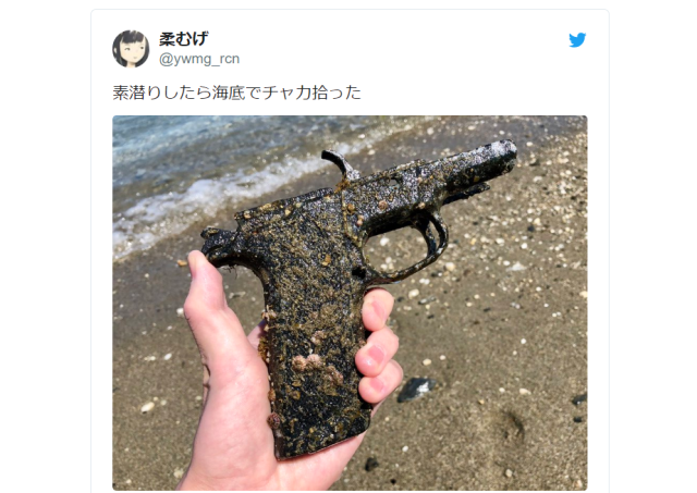 Japanese skin diver says he found this pistol just lying on the ocean floor