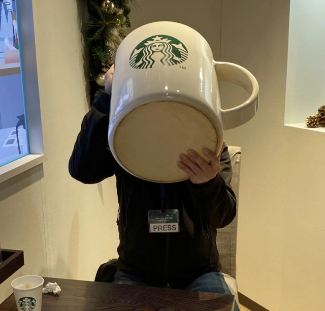 Giant, house-sized Starbucks Mug appears in Tokyo, so Mr. Sato grabs own huge  mug to check it out