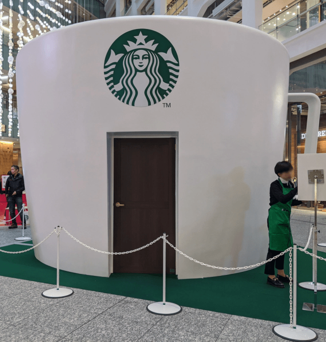 Giant, house-sized Starbucks Mug appears in Tokyo, so Mr. Sato grabs own huge  mug to check it out