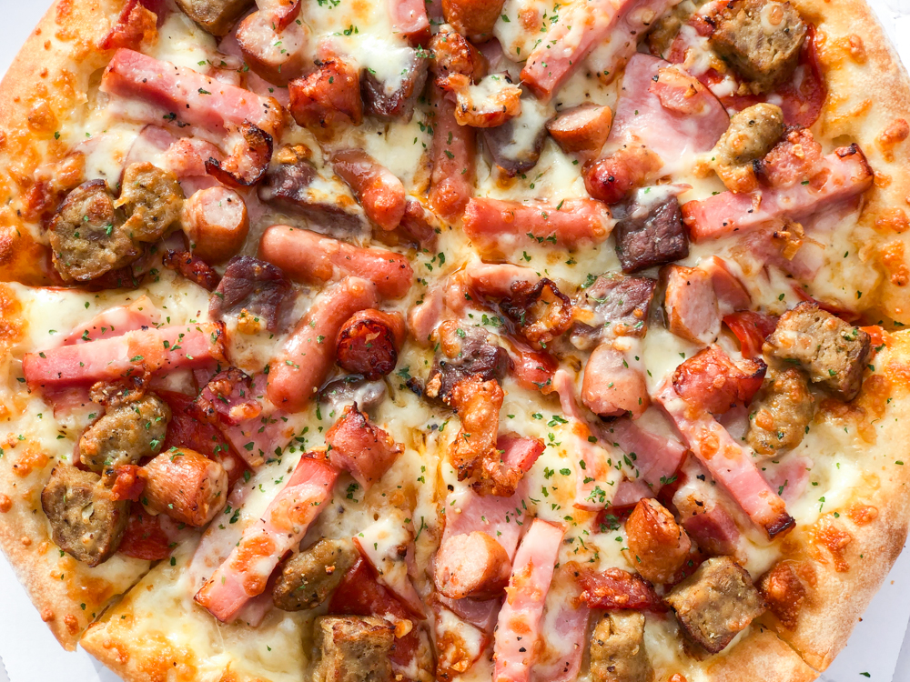 We try the giant Meat Mountain pizza sandwich from Aoki’s Japan