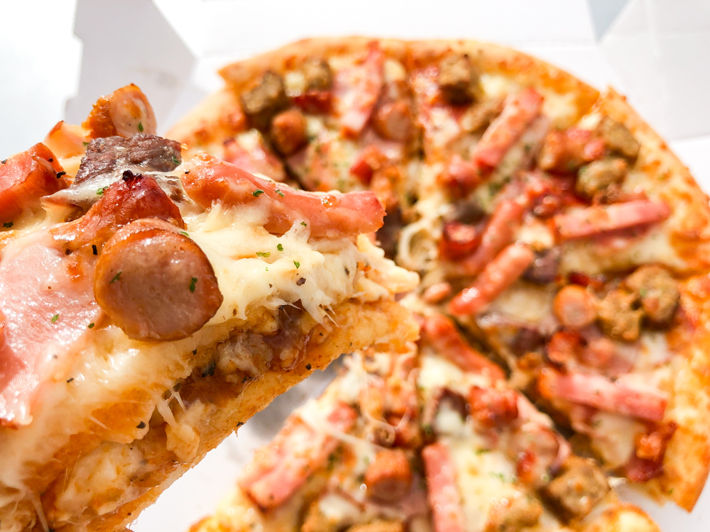 We try the giant Meat Mountain pizza sandwich from Aoki’s Japan