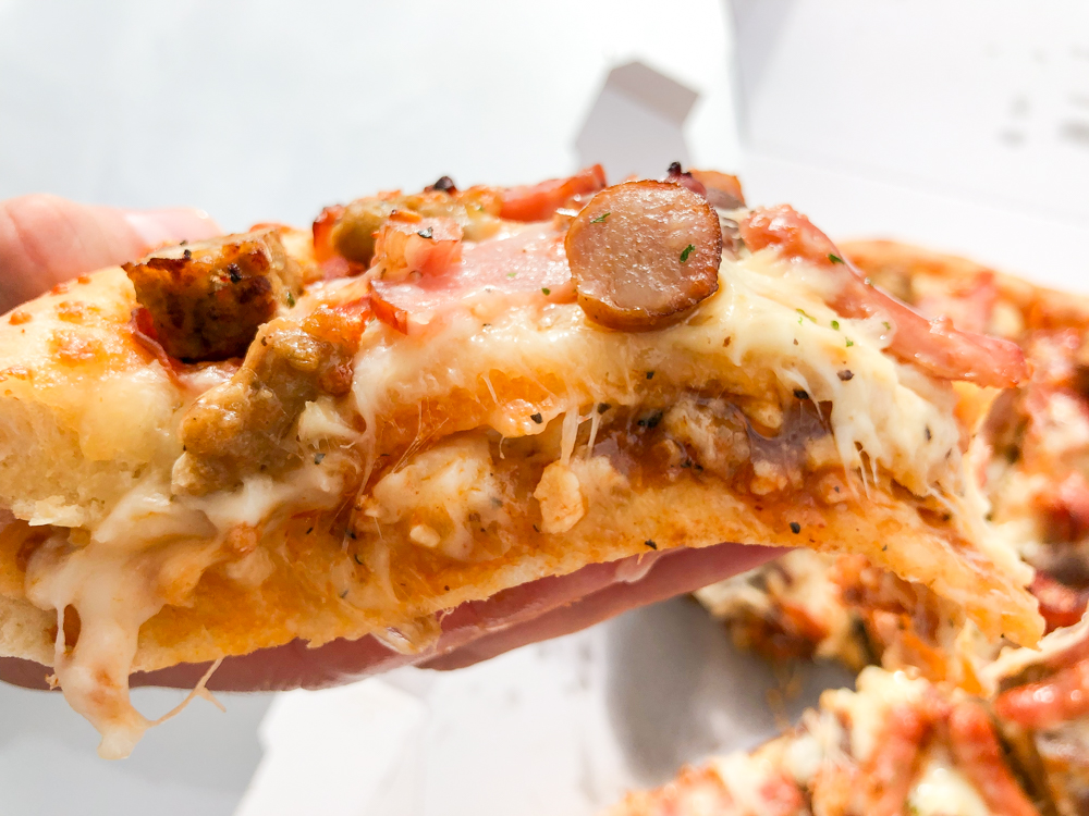 We try the giant Meat Mountain pizza sandwich from Aoki’s Japan
