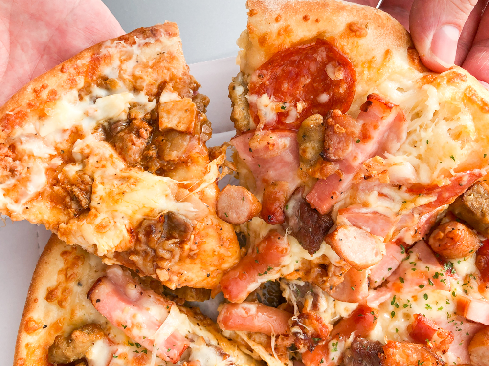 We try the giant Meat Mountain pizza sandwich from Aoki’s Japan