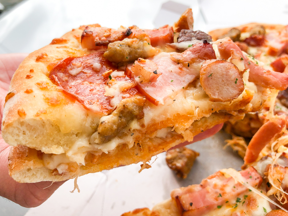 We try the giant Meat Mountain pizza sandwich from Aoki’s Japan