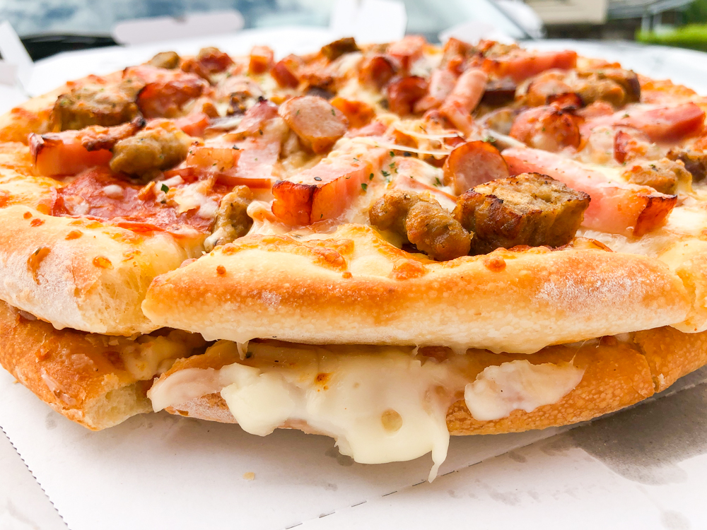 We try the giant Meat Mountain pizza sandwich from Aoki’s Japan