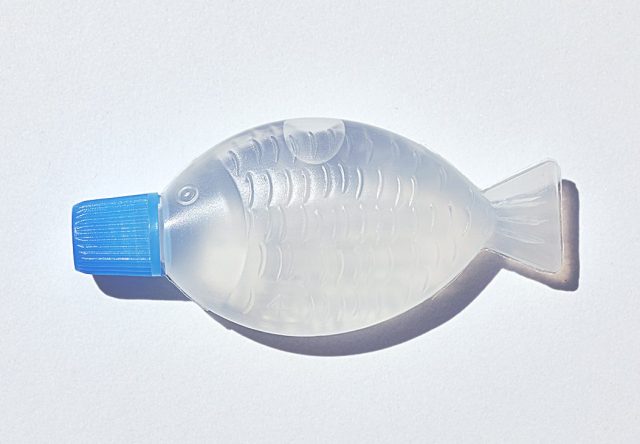 Tiny fish-shaped soy sauce bottles repurposed for sanitizers
