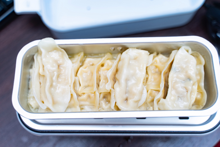 We try cooking lots of things with Japan’s double-decker one-person ...