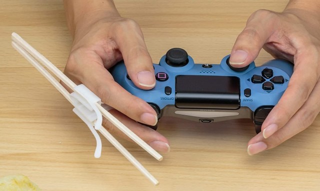 Japan creates gaming chopstick holder, because gaming doesn’t always stop when it’s time to eat