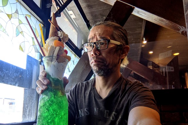 Mr Sato goes head-to-head with a giant cream soda parfait in a Tokyo cafe