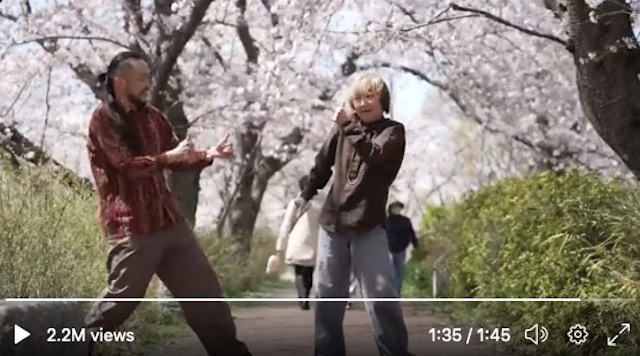 Mother and son duo dancing beneath the sakura trees will bring a smile to your day