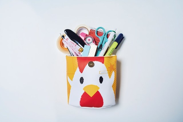 Karaage-kun pouches sold bundled with a magazine chronicling the fried chicken balls’ history