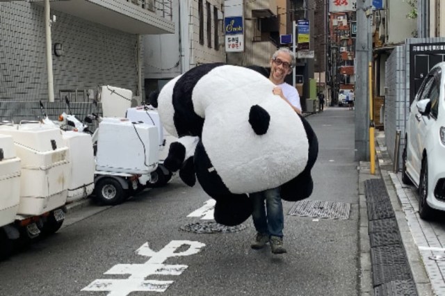 From a random alley in Tokyo, it’s the Running While Carrying a Giant Stuffed Panda Championships