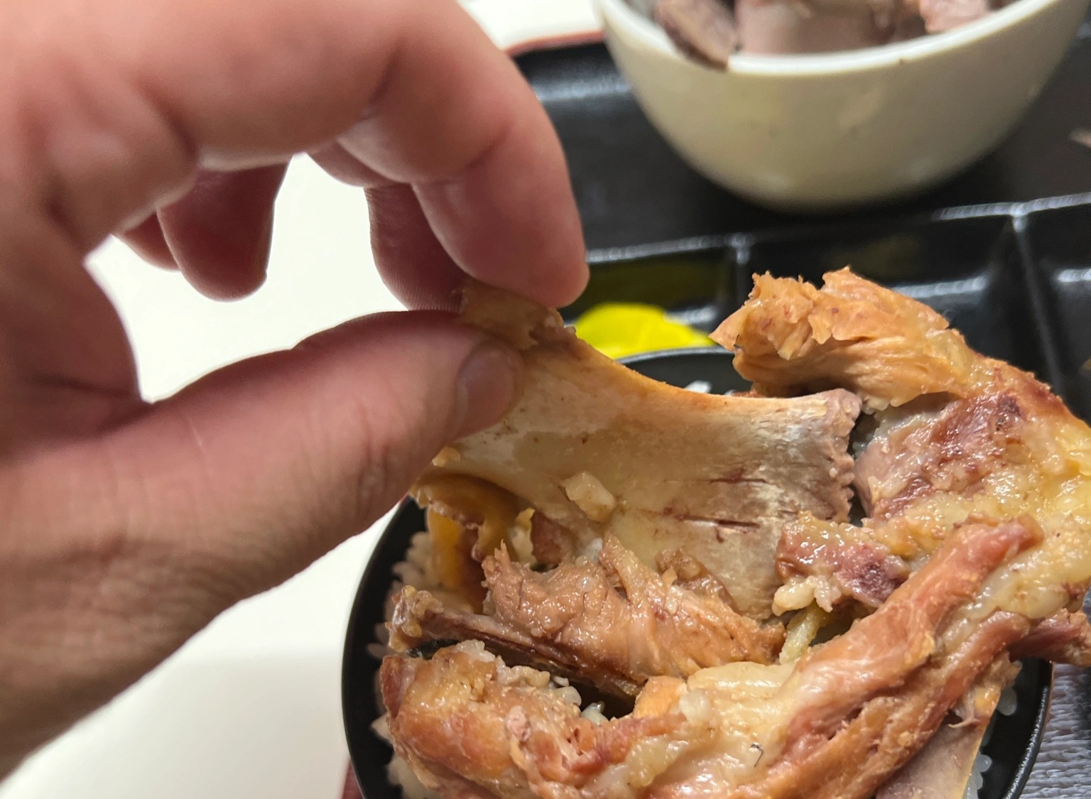 We try honejiru (bone soup), a delicious Okinawan specialty hard to