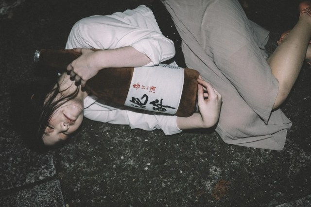 Drunk Japanese woman found sleeping in street by 86-year-old man who comes to her rescue