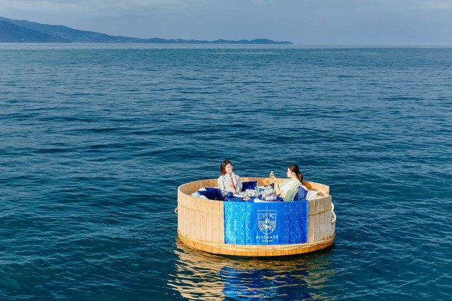Luxury hotel chain offering karaoke in a large tub floating on the ocean