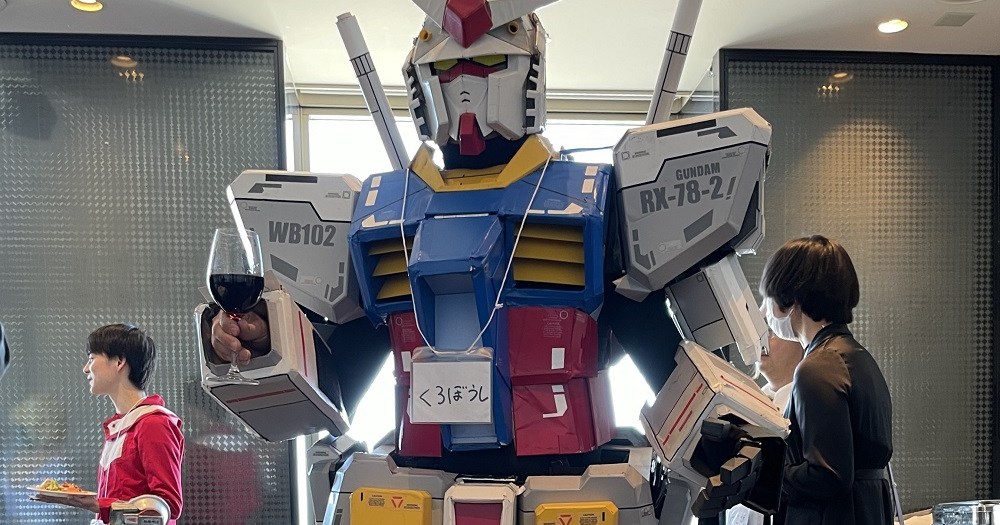 Japanese man tells friend to wear suit to wedding party, so he comes as Mobile Suit Gundam