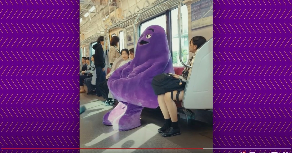 Grimace frightens schoolgirls, rides a Japanese train as the cult shake