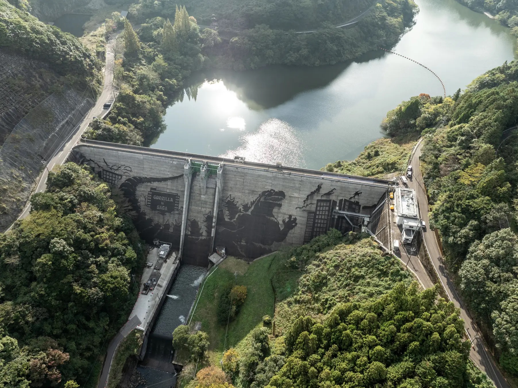 Godzilla art appears on 195-foot dam in Japan.