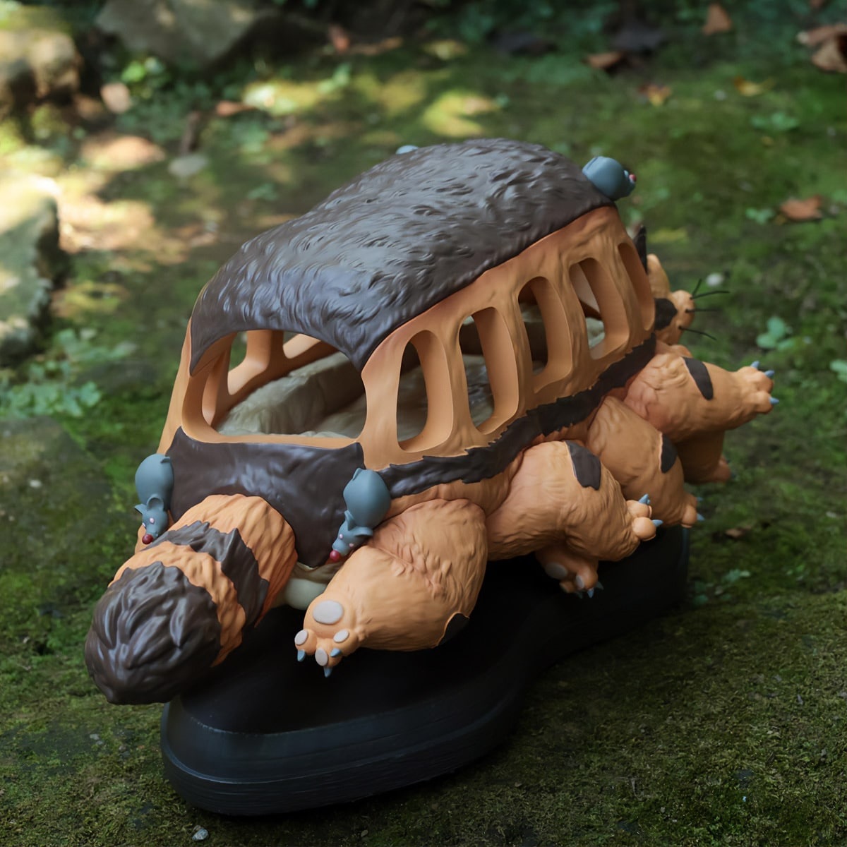 Two beautiful Totoro Catbus interior piece figures scamper back to