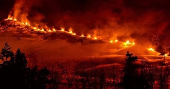 This hot springs town in Japan sets fire across a mountain every winter in a beautiful tradition