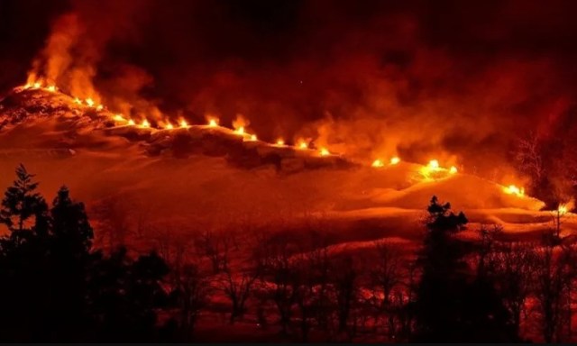 Japanese hot springs town ignites mountain annually in stunning tradition.