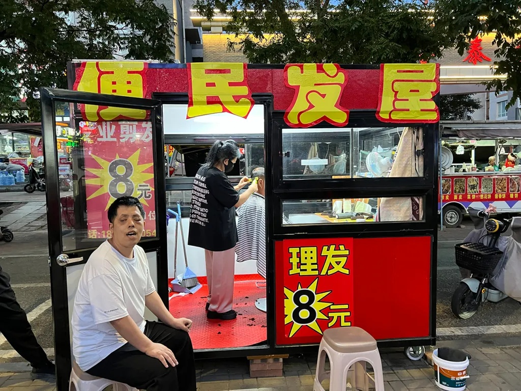 A roadside hair salon stall in China made us Norway’s Haaland for US$1, and warmed out hearts too