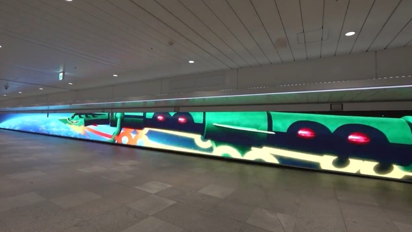 Life-size Mega Rayquaza greets travelers at Tokyo train station.